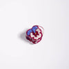 Colorful flower-shaped micro mini hair claw on a white background