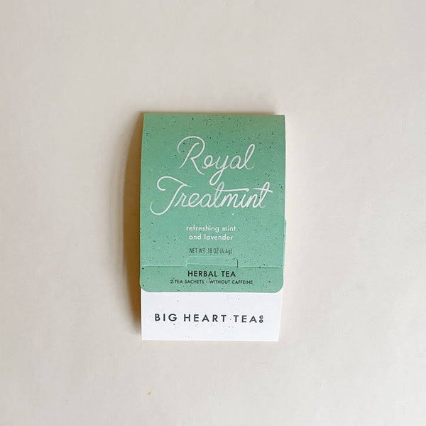 A packaged tea product labeled 'Royal Treatmint' by Big Heart Tea, featuring a green and white color scheme with text detailing the organic ingredients and the product description.